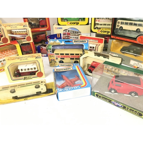 435 - A Collection of Boxed Die-Cast Buses and Vans etc.No Reserve.