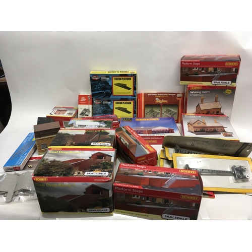 477 - A collection of boxed model railway accessories including buildings and track. Mainly Hornby 00 gaug... 