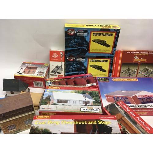 477 - A collection of boxed model railway accessories including buildings and track. Mainly Hornby 00 gaug... 