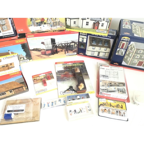 680 - 2 Boxes Containing a Collection of Boxed Hornby. Bachmann Boxed Buildings. And Kits.(2)