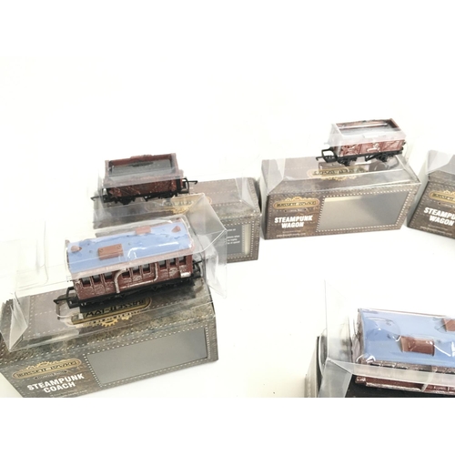 696 - A Collection of 00 Gauge Bassett-Lowke Wagons and Coaches.