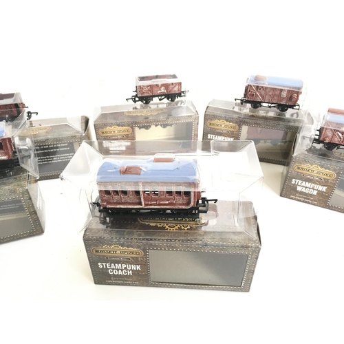 696 - A Collection of 00 Gauge Bassett-Lowke Wagons and Coaches.