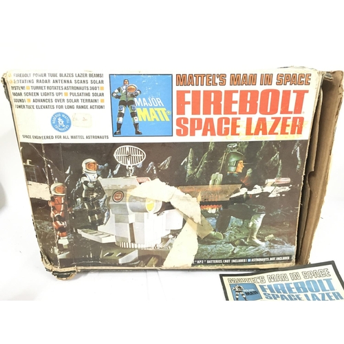 81 - A Boxed vintage Mattel Man In Space Firebolt Space Lazer. Box is worn and Damage to Lazer.