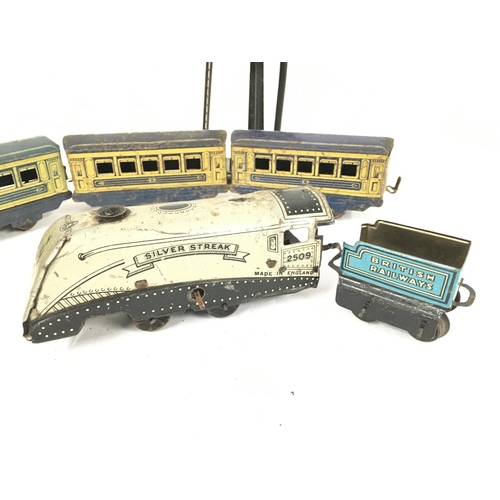 906 - A Vintage 0 Gauge Clockwork Silver Streak with 3 X Coaches.