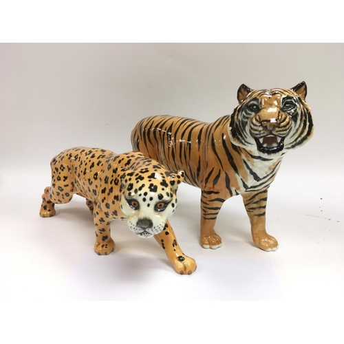 1011 - Two Beswick figures comprising a tiger and a cheetah, largest approx 19cm tall.