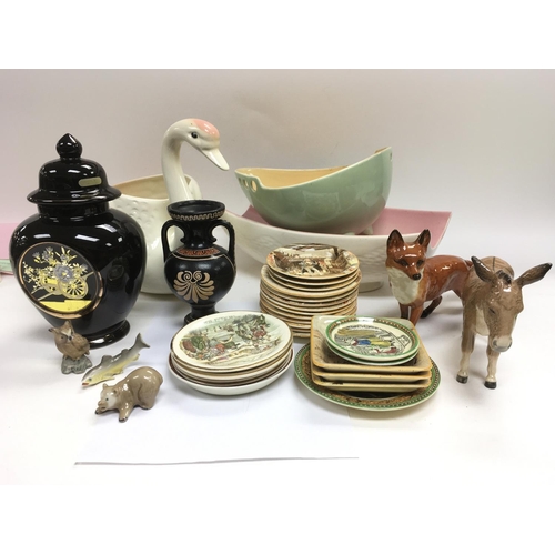 1012 - A box of ceramics including a Beswick donkey, Beswick fox, Newhall Dickensware dishes etc.