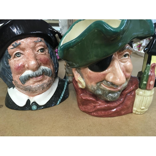 1066 - A collection of ceramics including Doulton jugs jazz band Staffordshire figure.