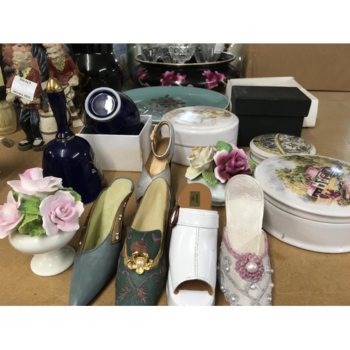 1067 - A pair of Poole plates decorated with flowers in silver and other ceramics.