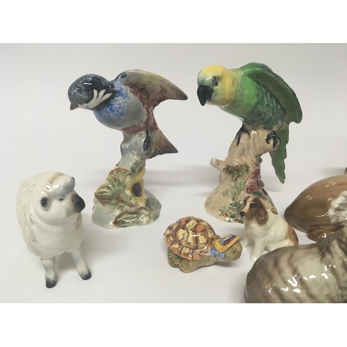 1077 - Two exotic Beswick birds other Beswick animals and simulated figures.