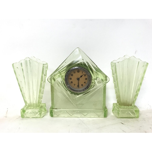 1078 - A collection of coloured glass ware including a clock, flower bowl and a biscuit barrel