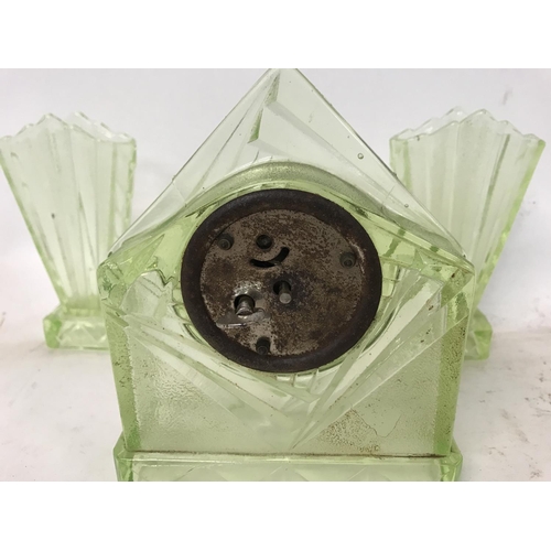 1078 - A collection of coloured glass ware including a clock, flower bowl and a biscuit barrel