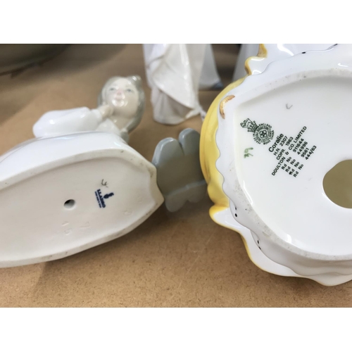 1097 - A small collection of Lladro, Nao (with needs of restoration) and a royal Doulton figure