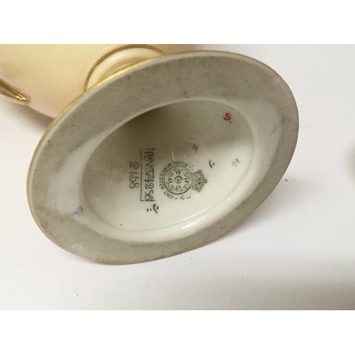 1100 - A hand painted Royal Worcester porcelain vase with flowers and foliage and applied gilt height 29cm