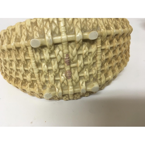 1103 - A Royal Worcester porcelain basket no obvious damage. Height 20cm.