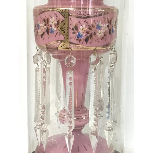 1106 - A pair of Victorian pink lustres hand painted and with applied gilt and cut glass drops, accommodate... 