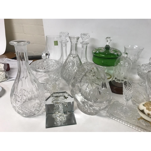 1111 - A collection of cut glass ornaments including decanters, glasses