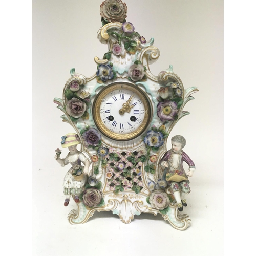 1190 - A quality late 19th century German porcelain clock the case encrusted with raised flowers with two s... 