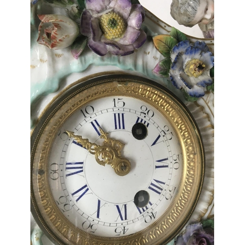1190 - A quality late 19th century German porcelain clock the case encrusted with raised flowers with two s... 