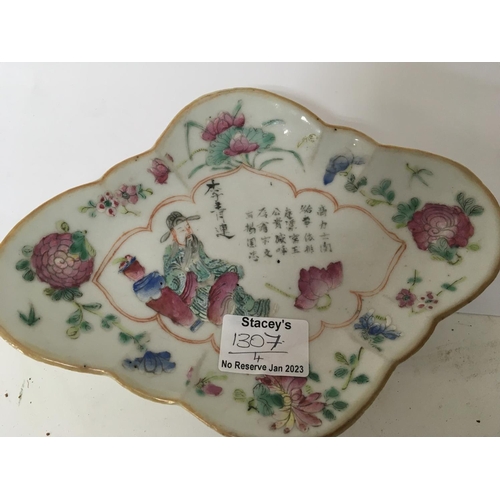 1307 - A 19th century Chinese export porcelain dish with hand painted inscriptions and three celadon plates... 