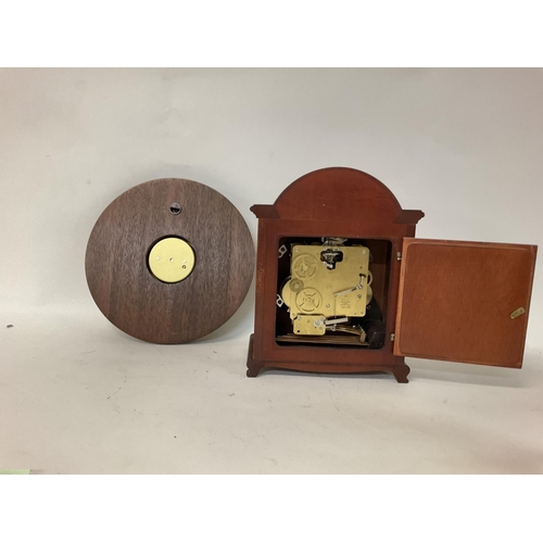 1507 - A modern clock and a barometer