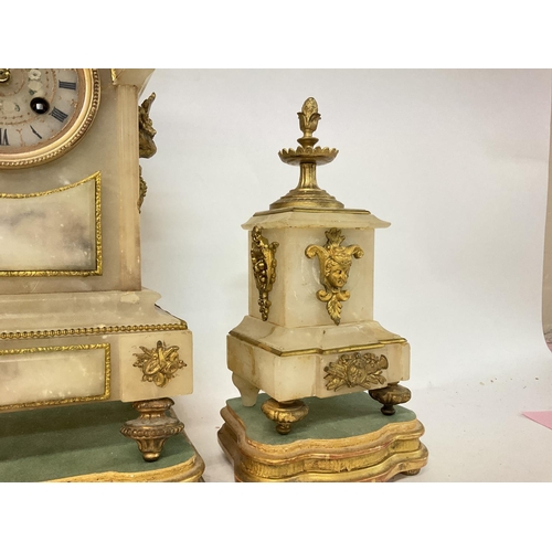 1509 - A French 19th century alabaster and gilt marble clock garniture
