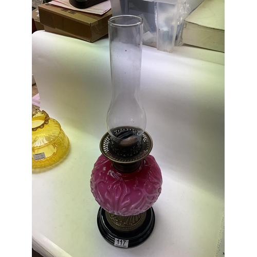 2103 - Victorian oil lamp with pink China reservoir and yellow glass shade on a brass and black base.