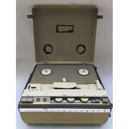 2294 - A Sony Sterecorder 464 reel to reel with service guide and a collection of reels.