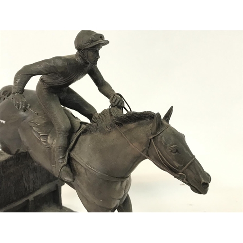 805 - Heredities Horse Racing statue titled- Over the last. 30x28cm approx