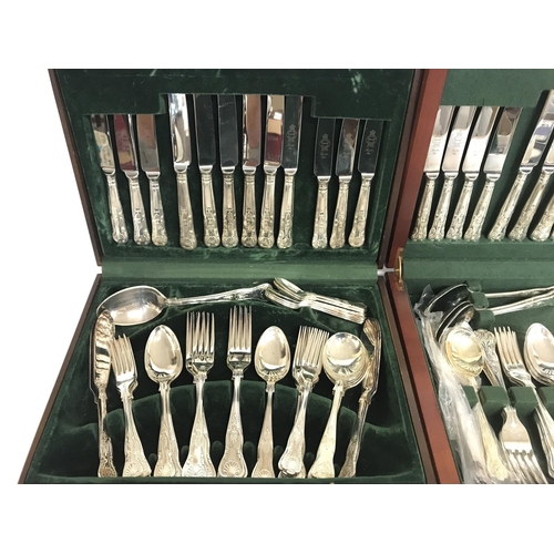 813 - Two sets of silver plated cutlery.