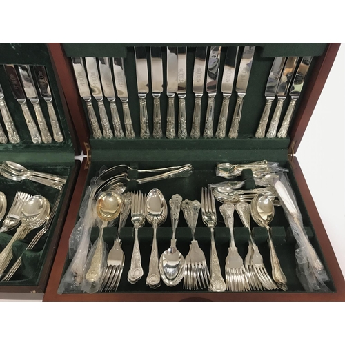 813 - Two sets of silver plated cutlery.