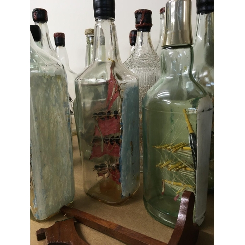 820 - A collection of glass ships in the bottles .