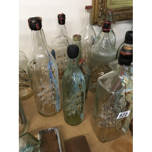 820 - A collection of glass ships in the bottles .