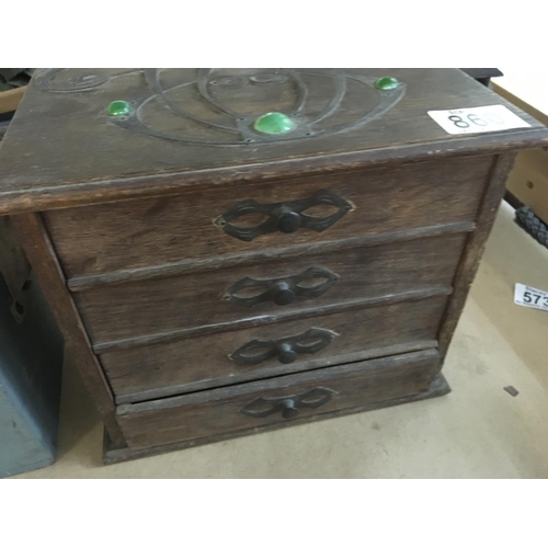 860 - A oak collectors cabinet fitted with four drawers with applied Art Nouveau Motifs.