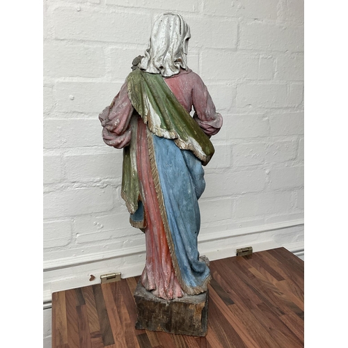 868 - An early Victorian carved wooden statuette of Madonna and child with polychrome painted body. 60cm