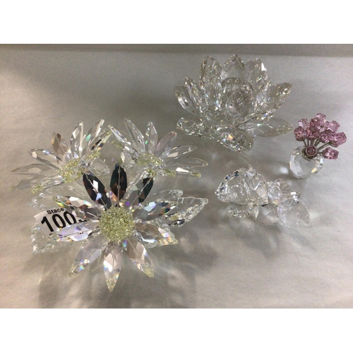 1005 - Four Swarovski flower pieces including large Maxi flower centre piece, Floating waterlily, miniature... 