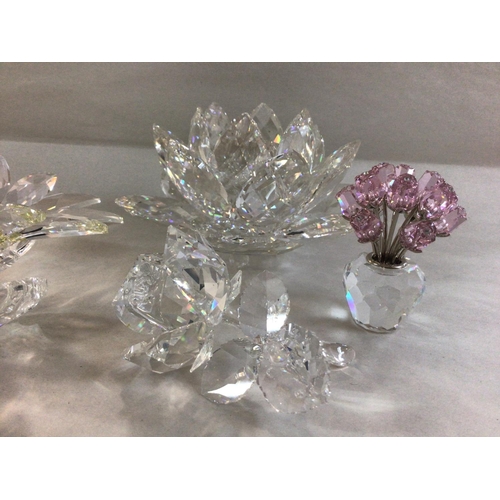 1005 - Four Swarovski flower pieces including large Maxi flower centre piece, Floating waterlily, miniature... 