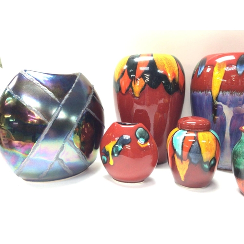 1030 - A collection of modern Poole vases ranging from 10 to 21cm tall