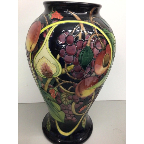 1128 - A  large Moorcroft vase of baluster form decorated with fruit and berries, by Emma Bossons, approxim... 