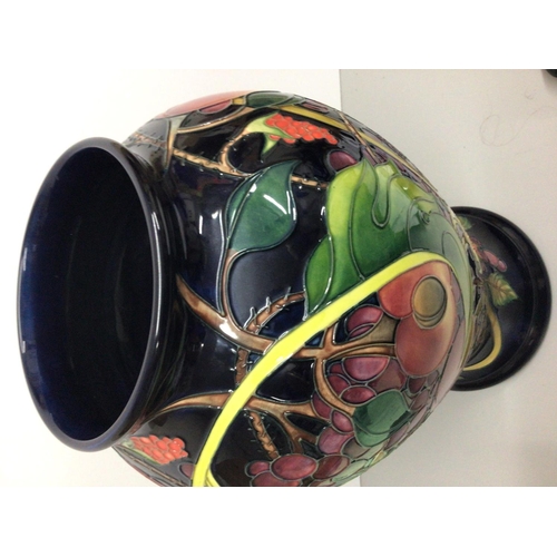 1128 - A  large Moorcroft vase of baluster form decorated with fruit and berries, by Emma Bossons, approxim... 