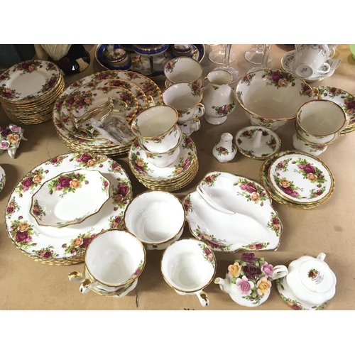 1129 - A collection of Royal Albert old English country rose dinner and tea ware including a three tier cak... 