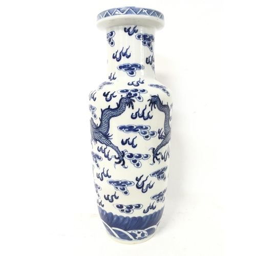 1213 - A 19th century blue and white Chinese dragon vase, approximately 30cm high.