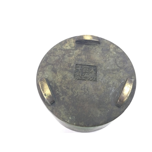 1235 - A Chinese bronze censer with character marks to base, diameter 11cm.