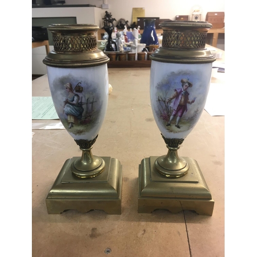 1305 - A late Victorian brass mantle clock with painted glass rococo style panels. And two brass and painte... 