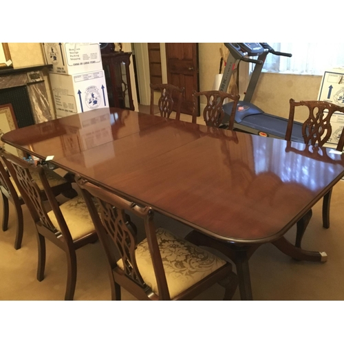 1363 - A quality Mahogany George III style dining table with a set of ten dining chairs.