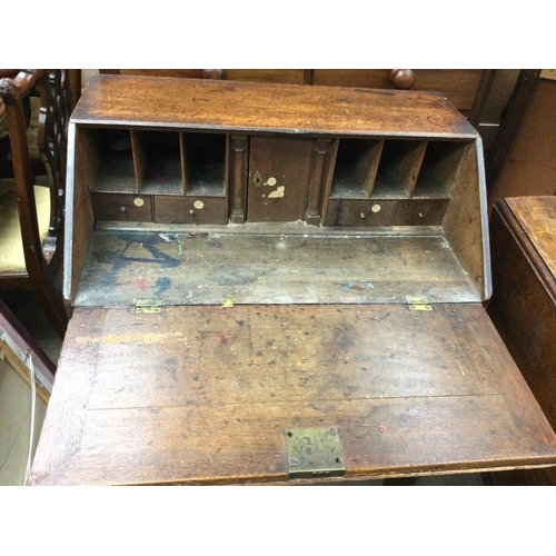 1384 - An oak bureau arts and crafts style. 76cm wide 47cm deep and 94 high.