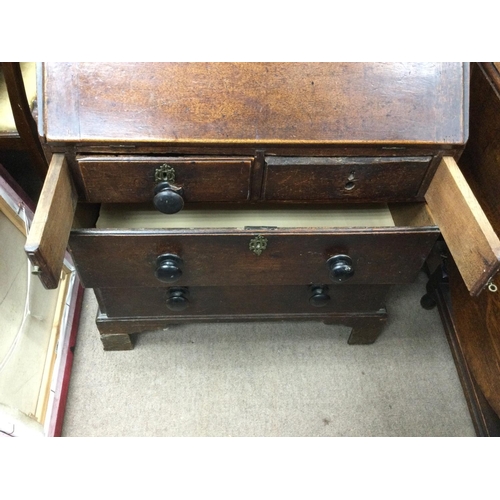 1384 - An oak bureau arts and crafts style. 76cm wide 47cm deep and 94 high.