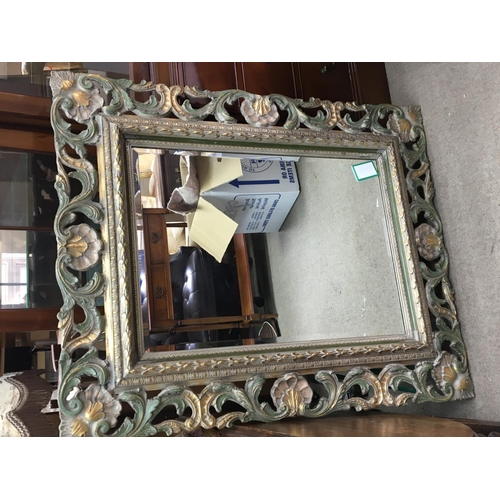 1405 - A modern mirror with shell and scroll decoration. With a beveled edge. 112x90cm