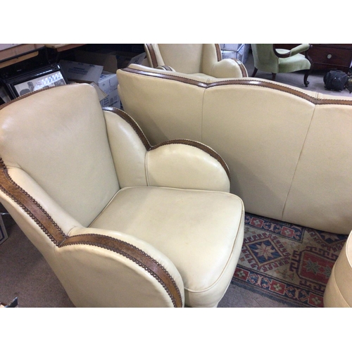 1417 - A Art Deco three piece cloud suite in cream with walnut trim , With foot stool.