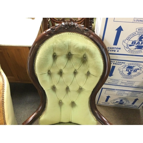 1420 - A Victorian carved oak open arm chair. 70cm wide by 90cm high approximately.