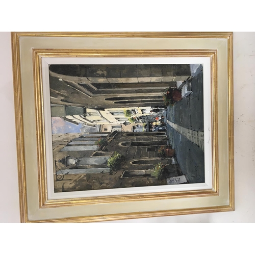 1474 - A framed oil paging a street scene of Pezenas France with figures. Signed by Jeremy Barlow ROI (1945... 